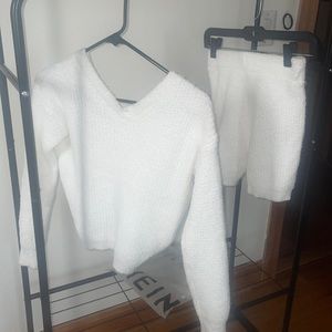 worn once w rouche in the back. 2 piece soft white fuzzy crop top & shorts